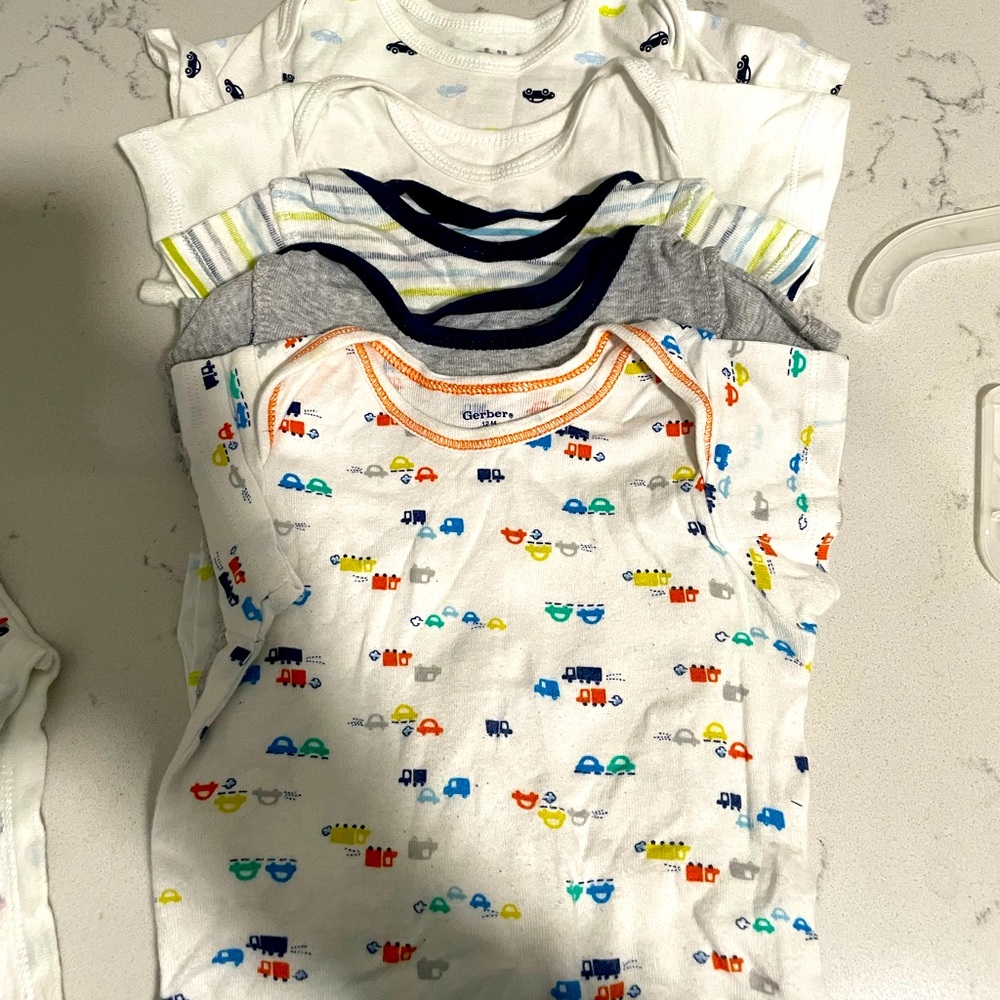 Onesies comprised of 3 different sizes - 0-3, 12month and 18months
